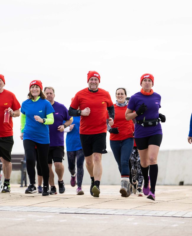 Runners along the coast in Porthcawl